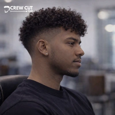 Curly burst fade haircut with curly fringe