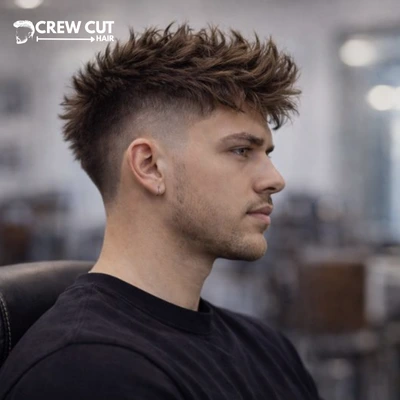 High burst fade haircut with messy top