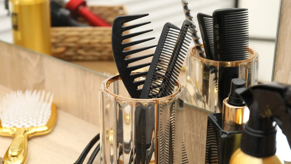 Barber cutting low taper mullet with scissors and comb