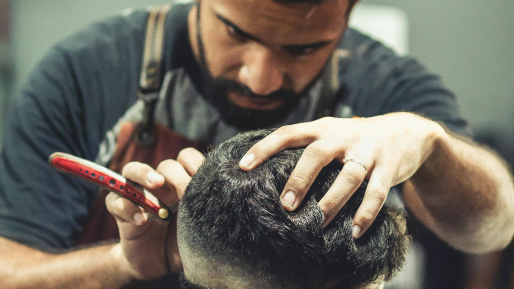 Side view of Buzz Cut Low Taper haircut with smooth low taper near ears